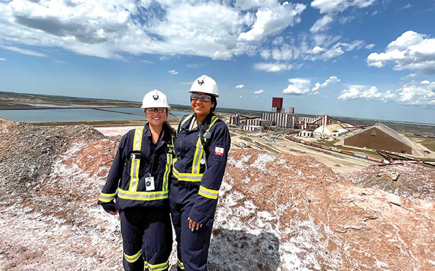 Sunnette Kamffer and Sierra D’Souza Butts at the top of the salt pile at the Rocanville site.